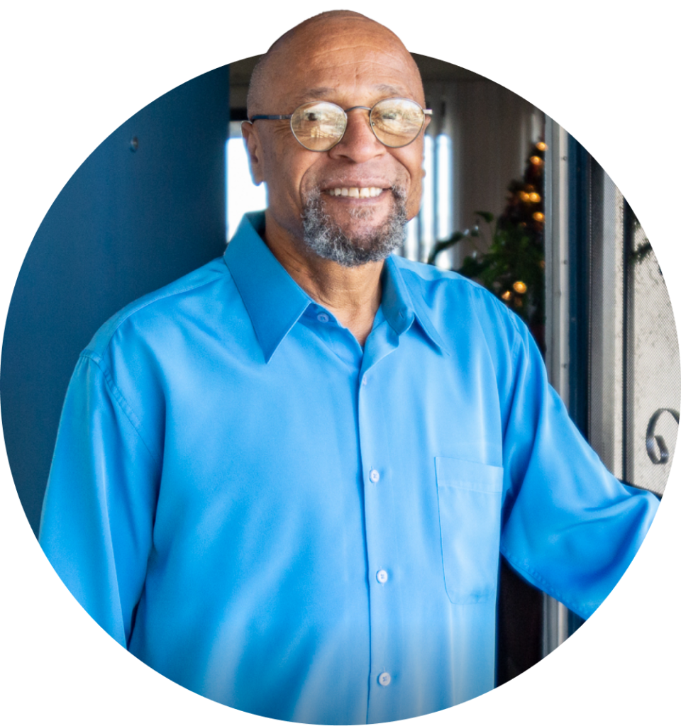 A LeaseUp tenant smiles in front of his apartment